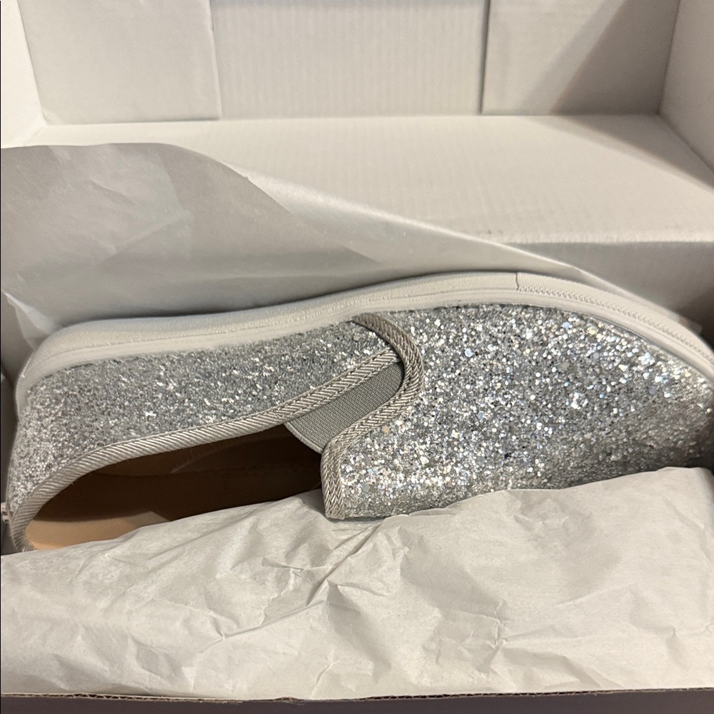 Women silver glitter slip on sneakers.